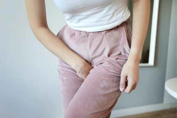 woman running for the toilet because of urinary incontinence Norwood Green